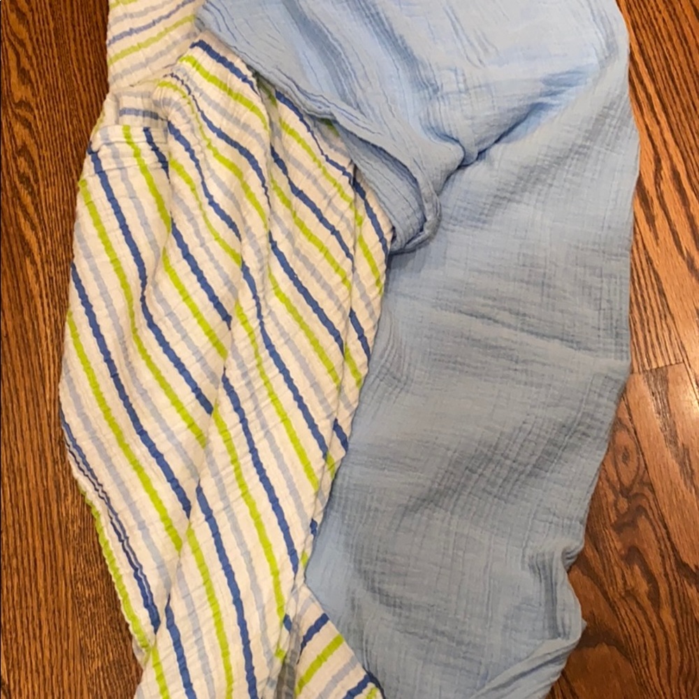 2 First Impressions swaddle blankets.